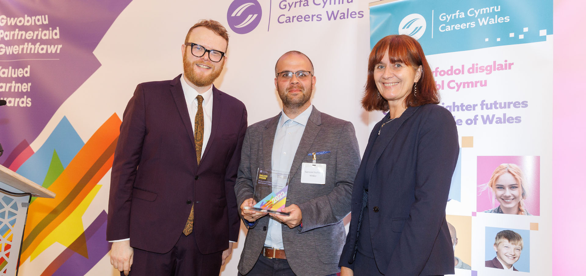 Eamonn Scullion from Viridor being presented with their award by presenter Huw Stephens and Nikki Lawrence, Chief Executive, Careers Wales