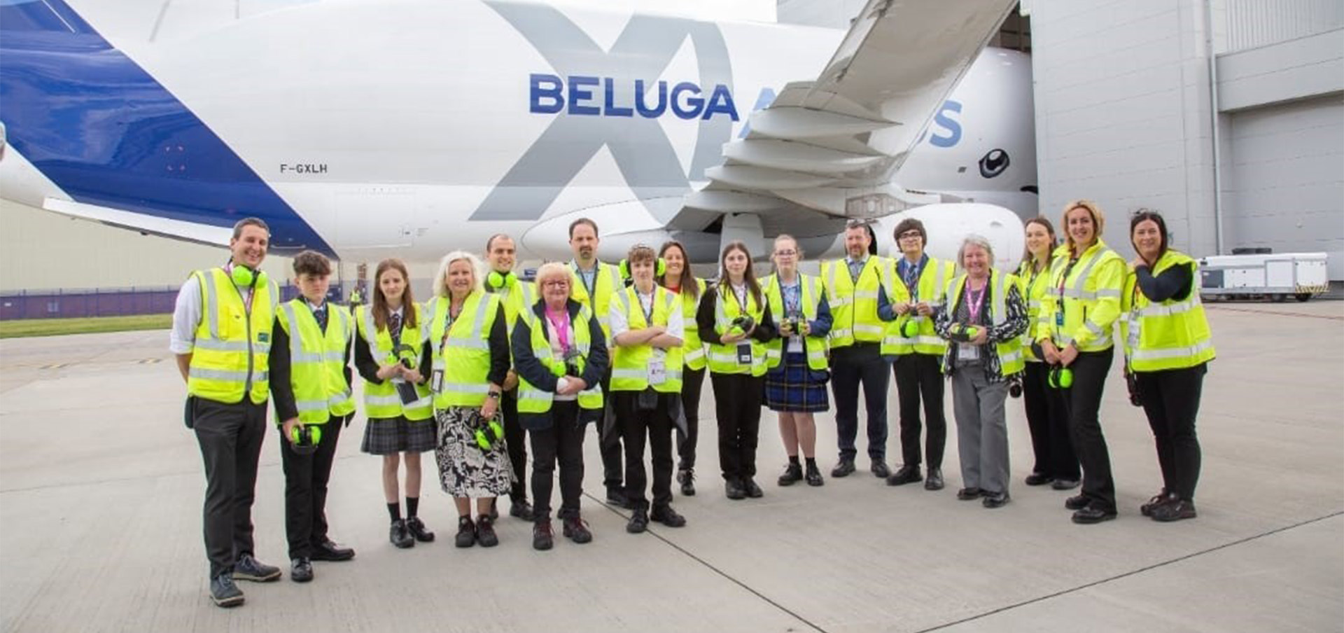 Airbus staff and pupils standing in front of an aeroplane