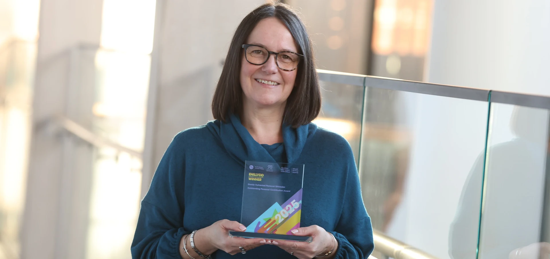 Catrin holding her award