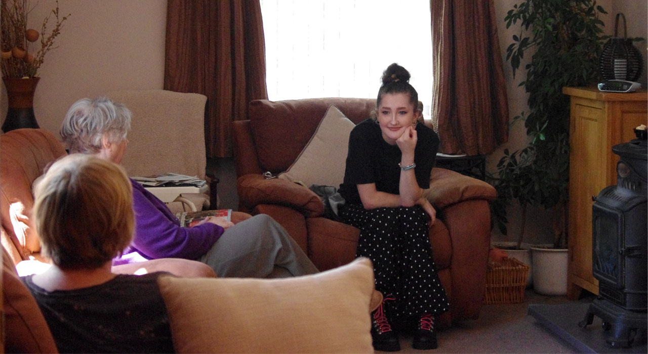 Young person talking to family