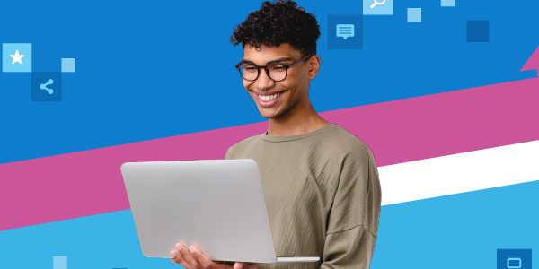 Smiling person holding a laptop