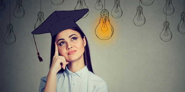 Graduate thinking (a lightbulb emoji is above her)